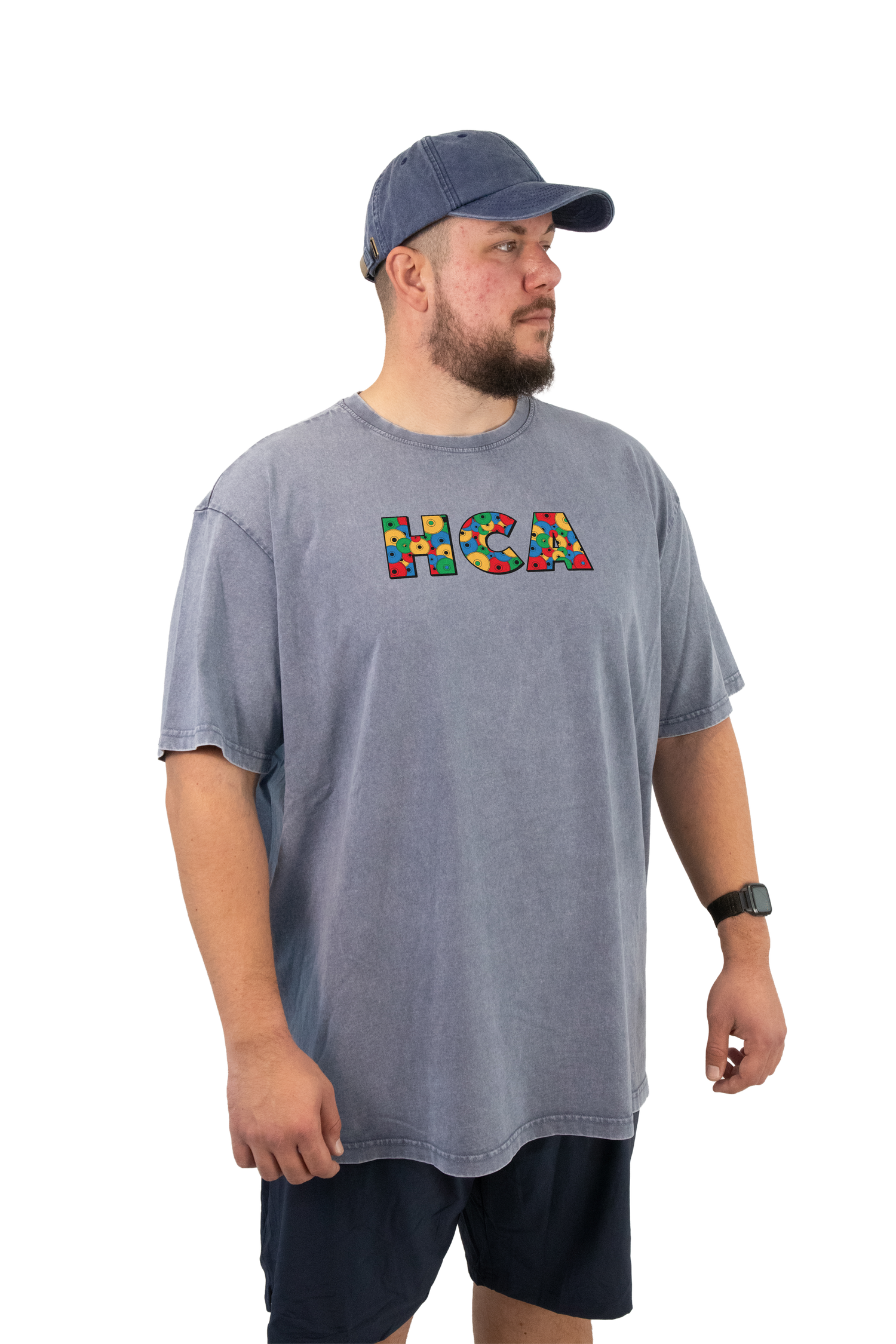 A flay lay of a black sweater featuring a large front print that says 'HVYCRCL Apparel'